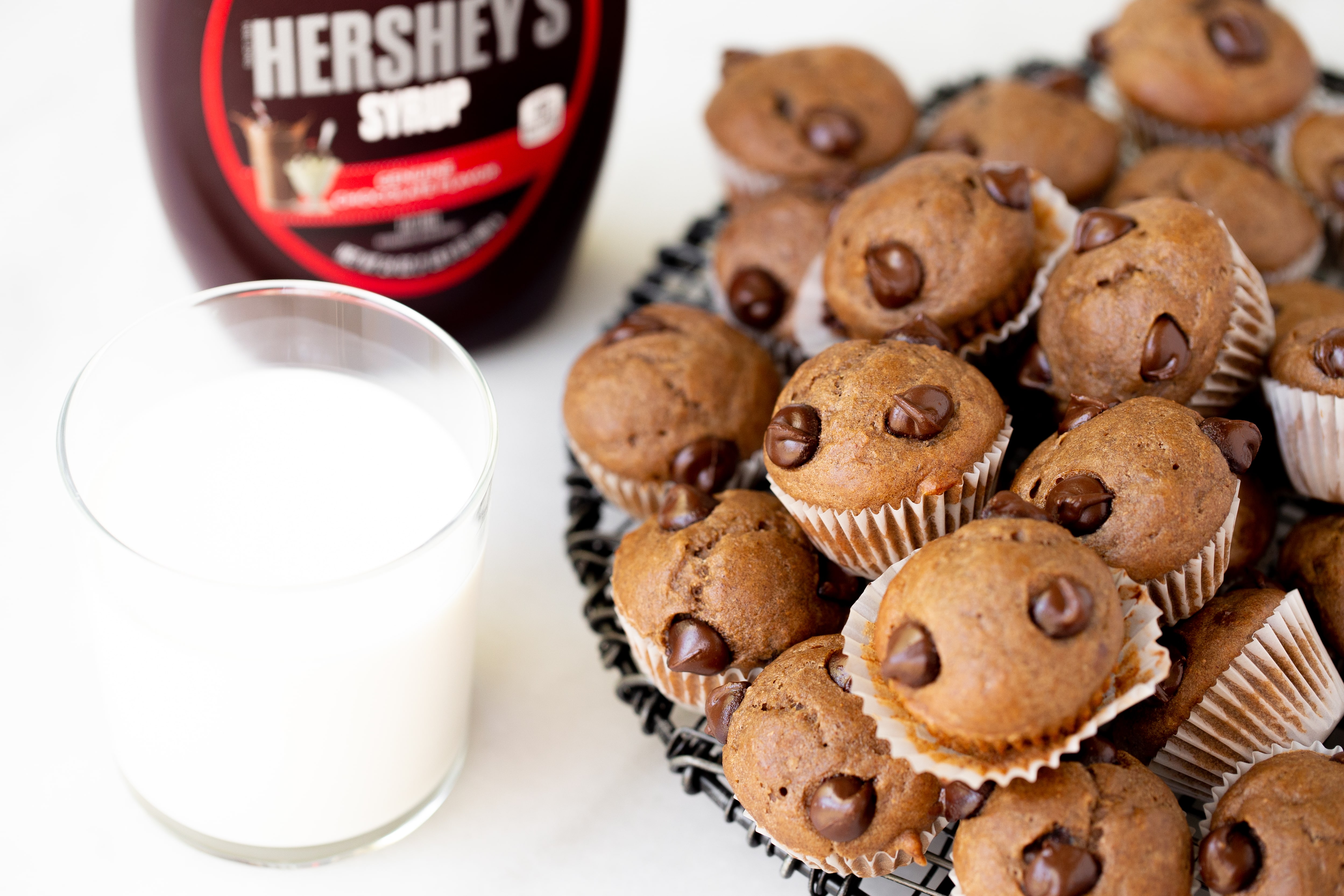 Hershey’s peanut butter banana muffin recipe with a glass of real milk.